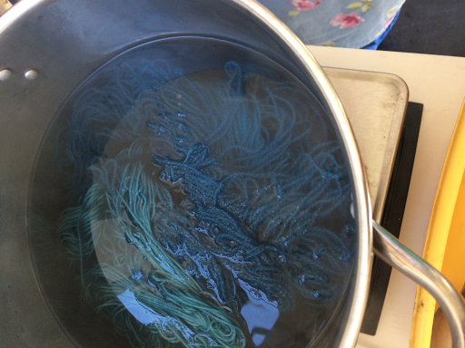 simmering wool in pot