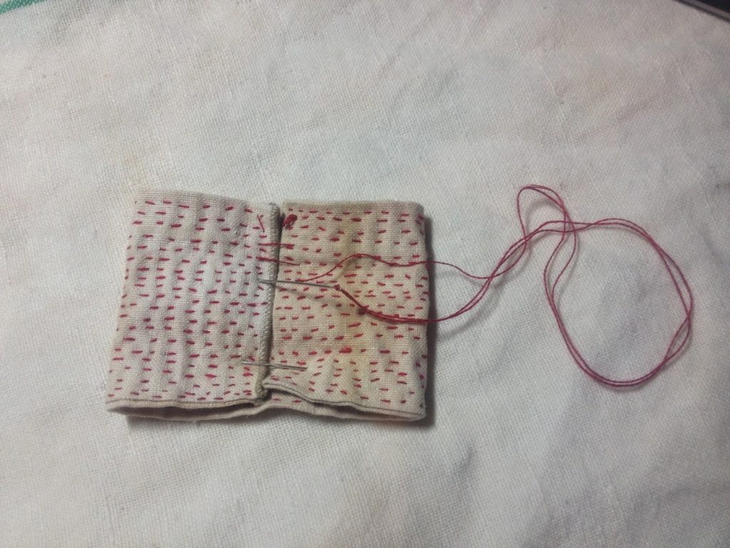 little red bow - I used the fabric I covered in Kantha stitches