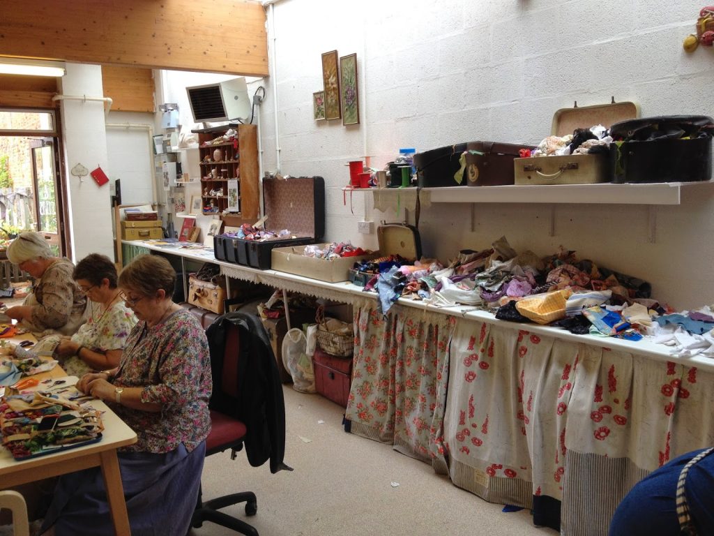 Students rummaging in the fabrics, designing and stitching