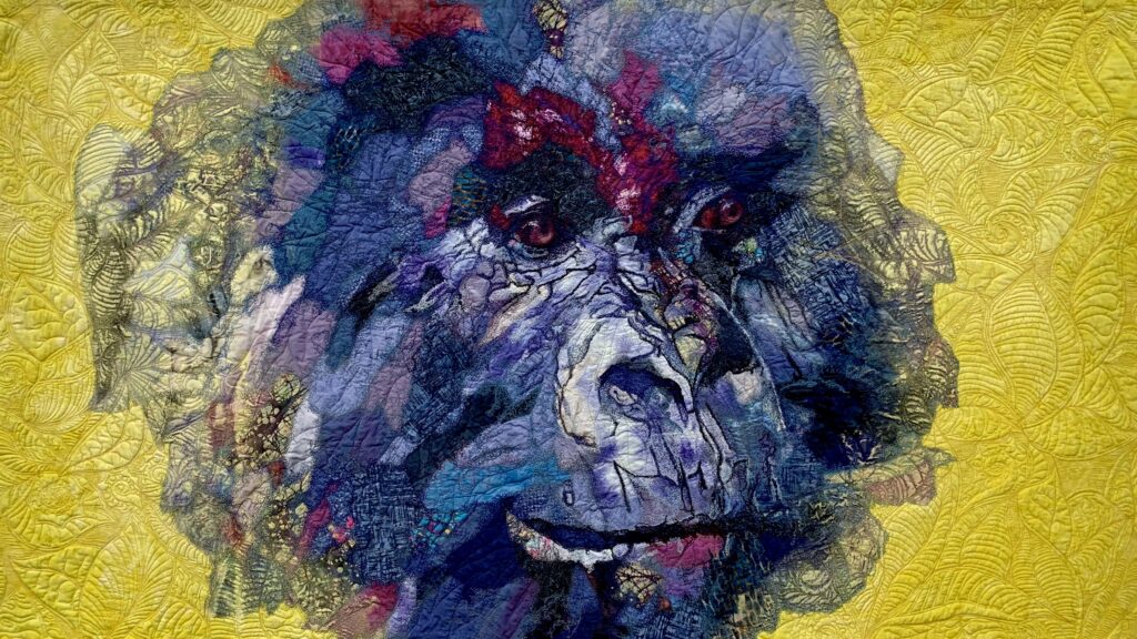 Testile art image of a gorilla on a yellow background