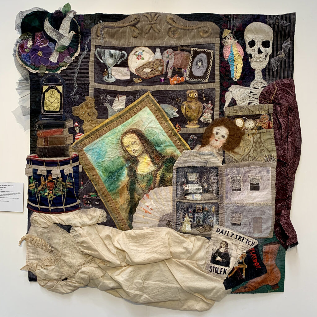 Artwork by Sylvia Paul - handmad quilt featuring images of theings found in an imaginery attic - a skull, Mona Lisa, spiders