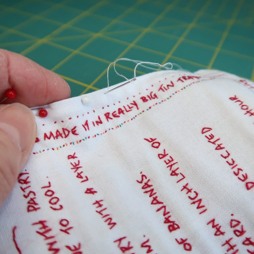 Finishing the piece with a hand stitched edge.